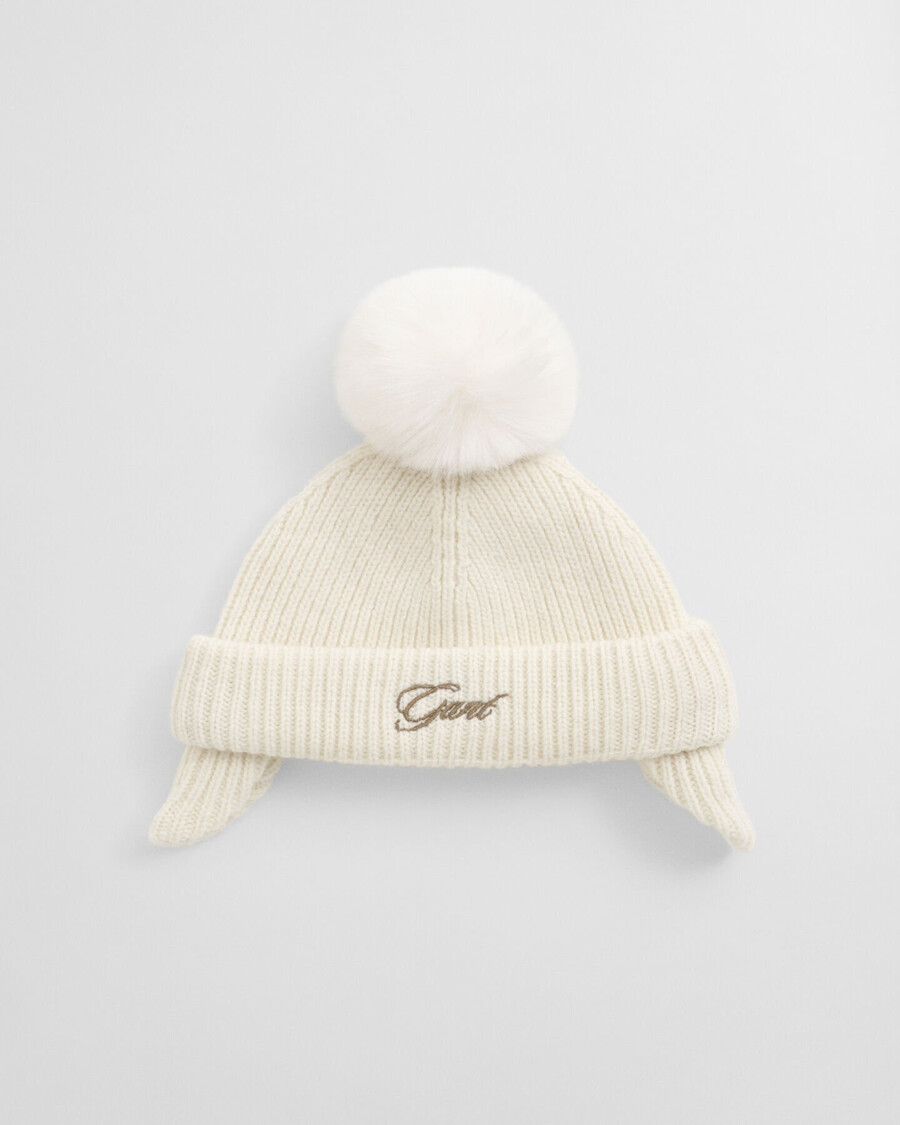 babymutsje met oorklappen en pompon - crème