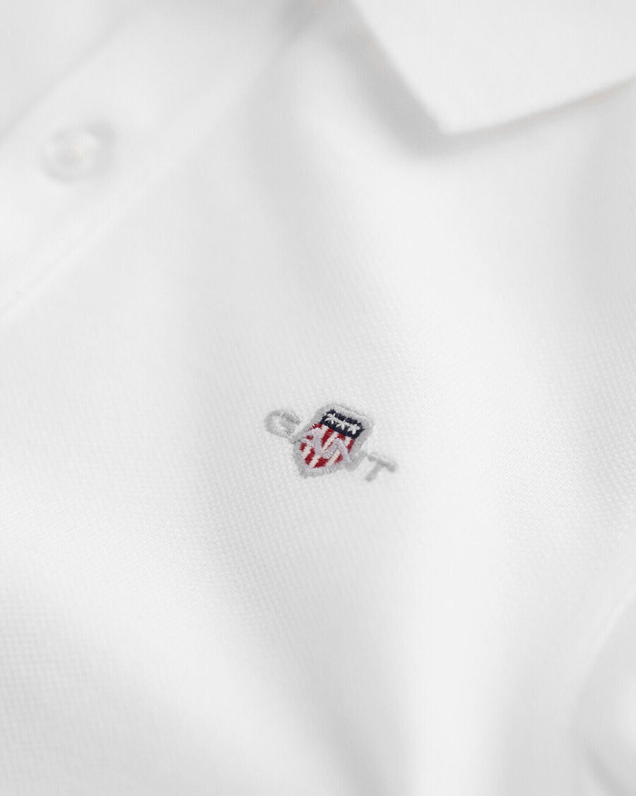 kinderpoloshirt van piqué met schildmotief - wit