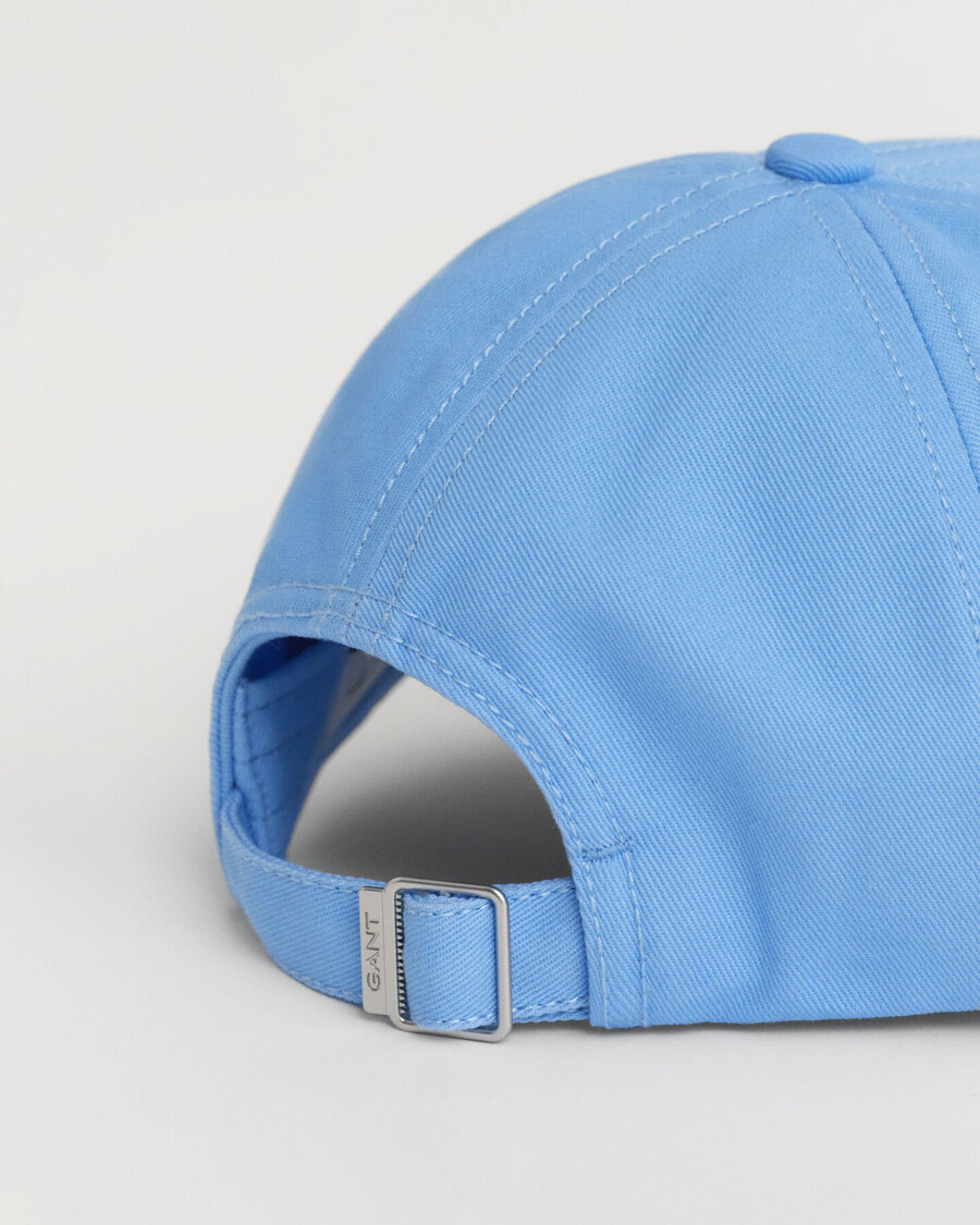 kinderpet van katoenen keperstof met schildmotief - droomblauw