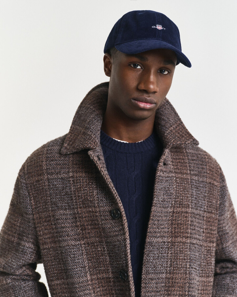 corduroy pet met schildmotief - marine