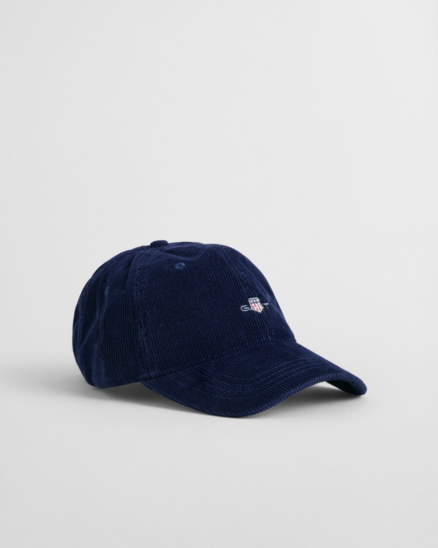 corduroy pet met schildmotief - marine