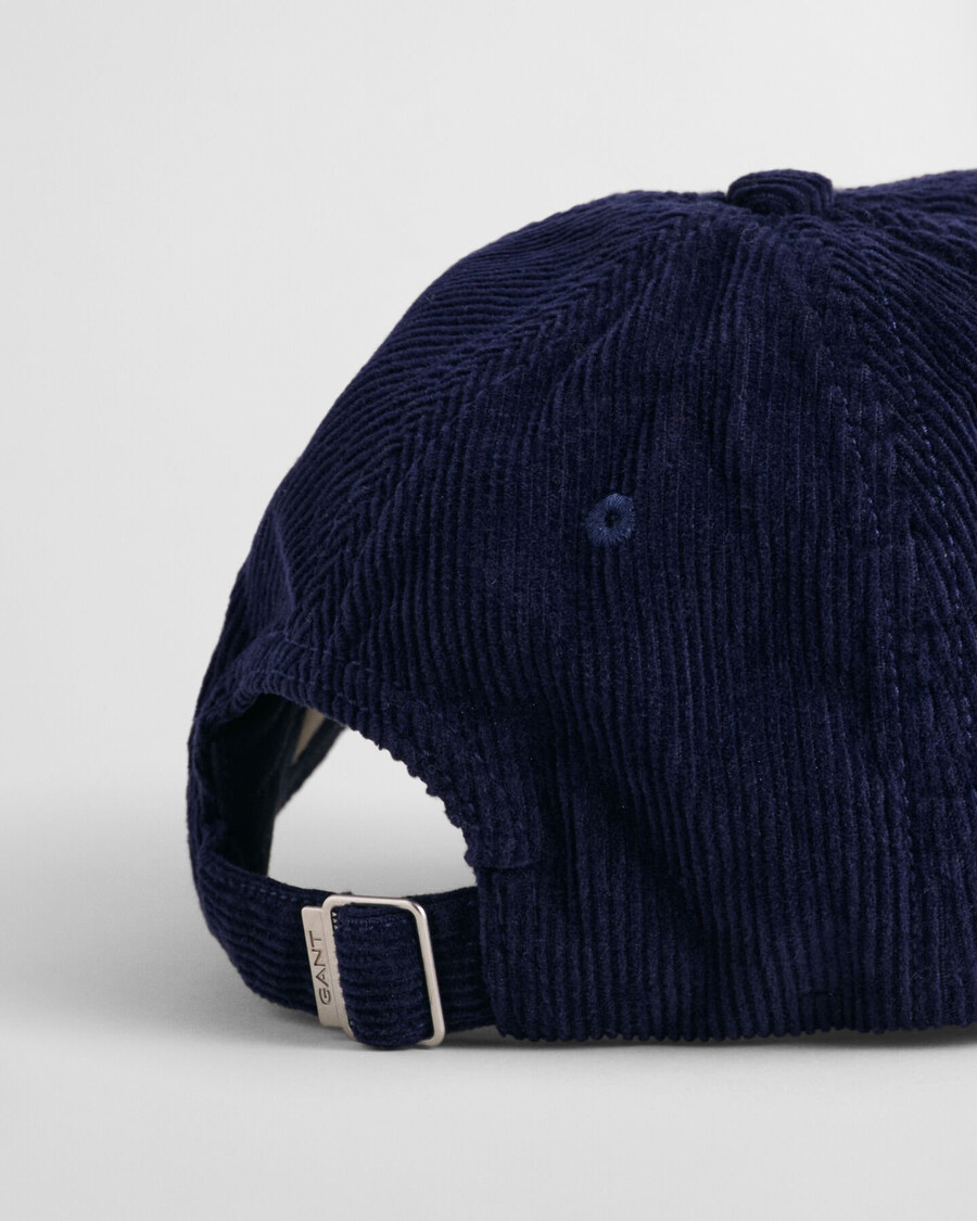 corduroy pet met schildmotief - marine